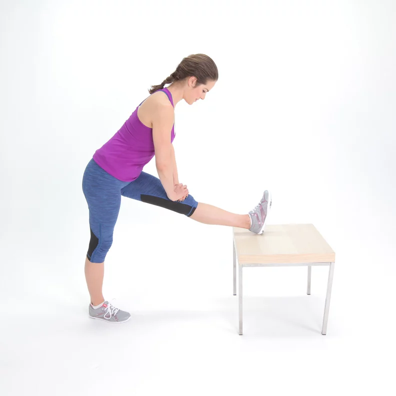 Standing hamstring stretch using a table