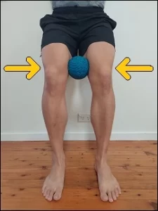 Squat with a Ball Squeeze