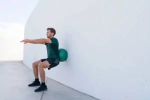 wall squat with a ball