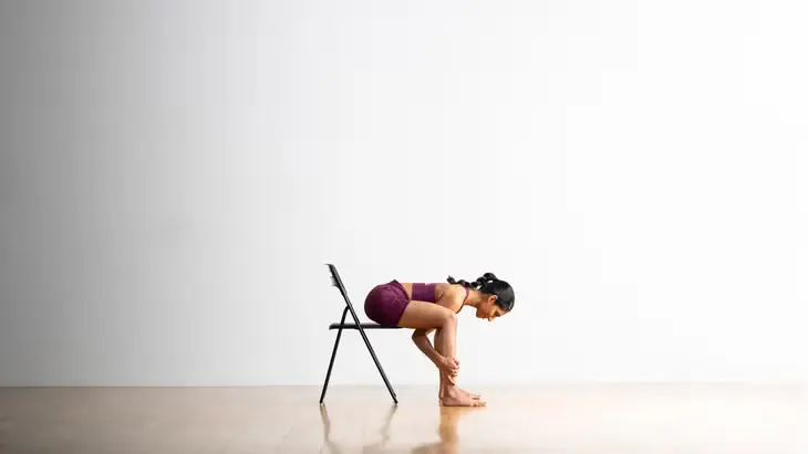 Happy Baby pose in chair